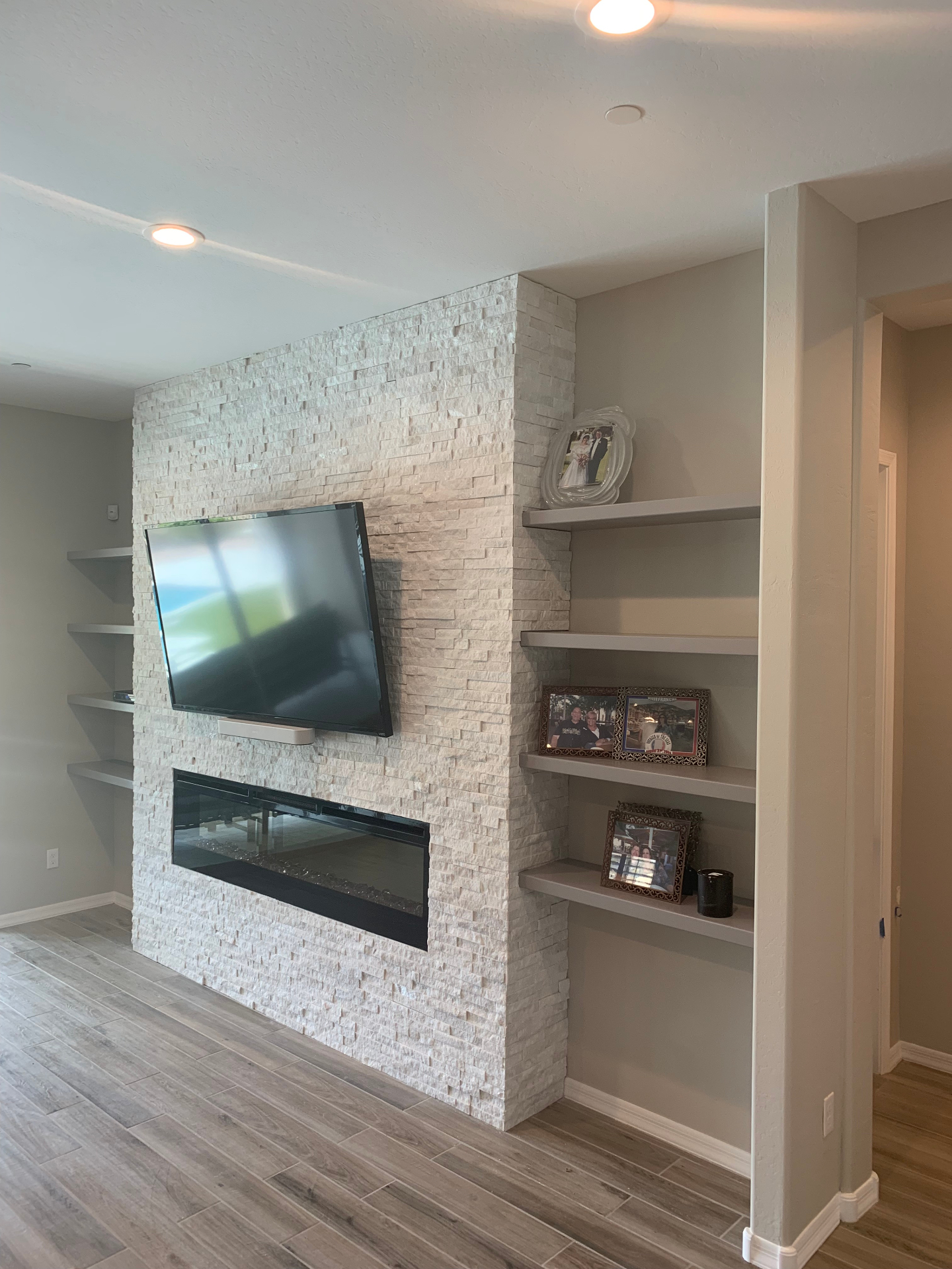 Real JBS project · Stacked-stone fireplace wall