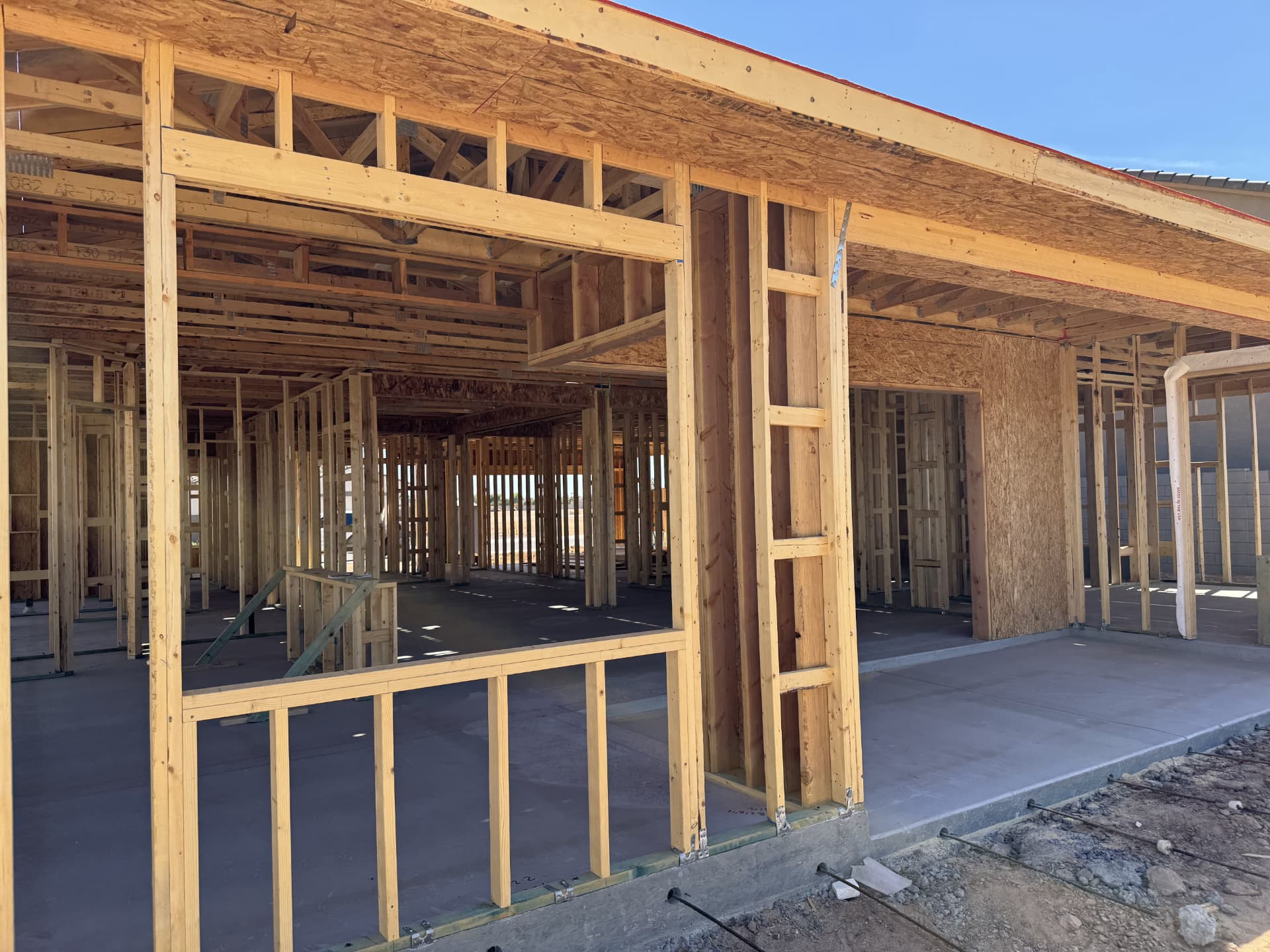 Framed custom home with roof sheathing complete