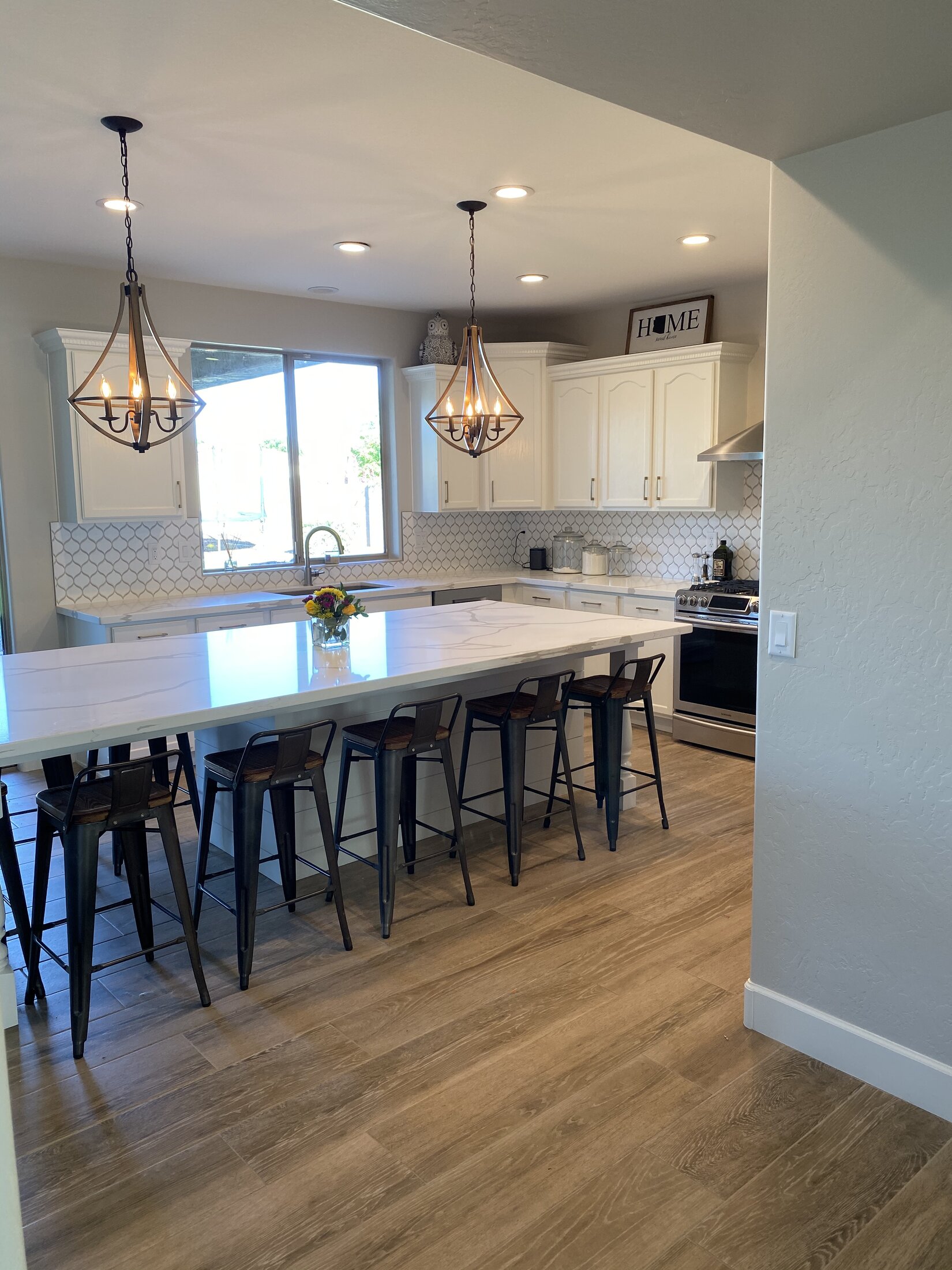 White shaker kitchen remodel with oversized marble island, Goodyear AZ