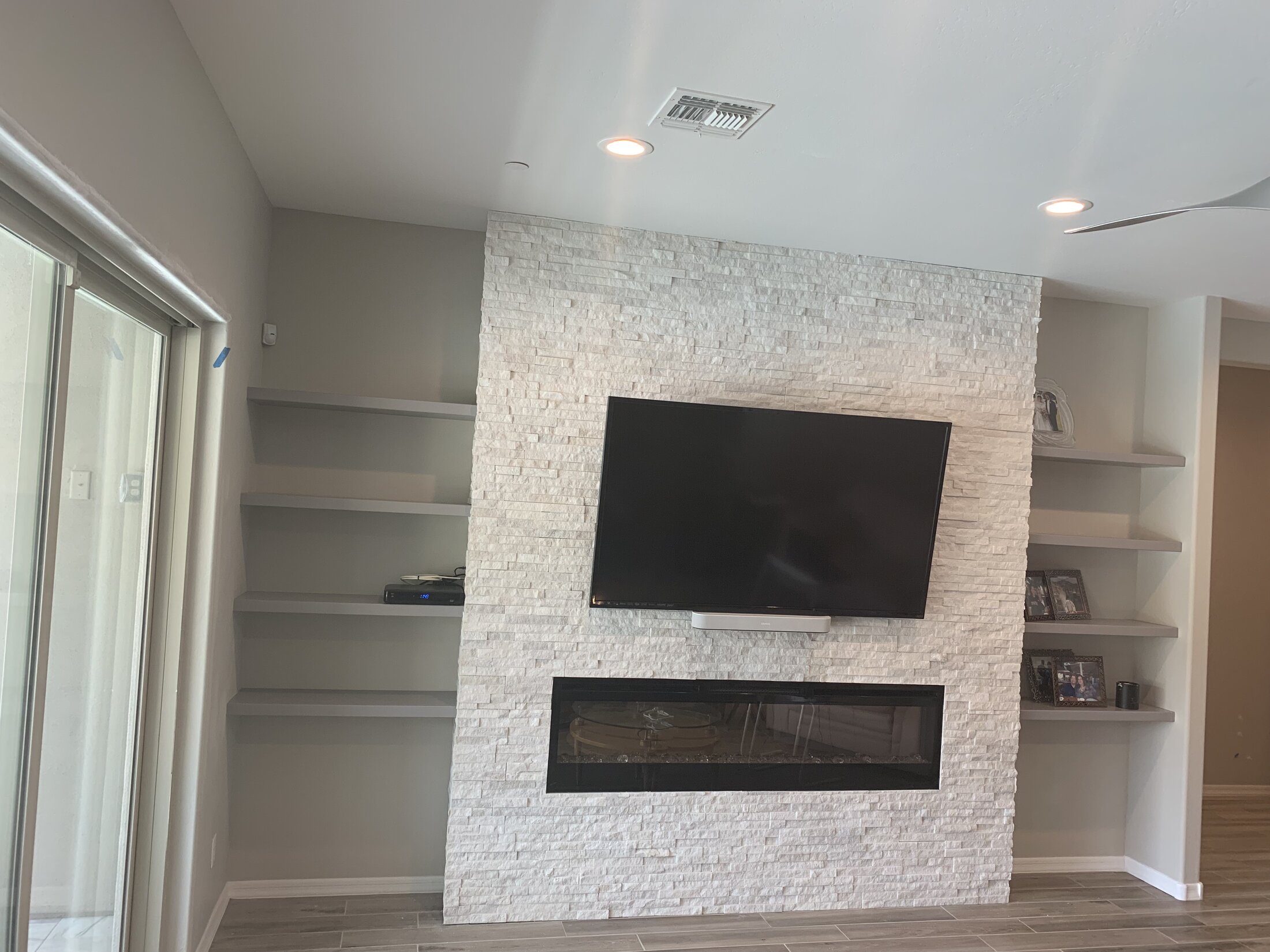 Stacked stone fireplace feature wall, living room remodel West Valley AZ